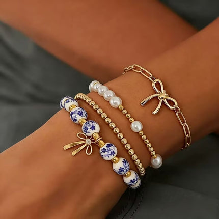 Minimalist Bow Pendant Bracelet with Pearl Accents