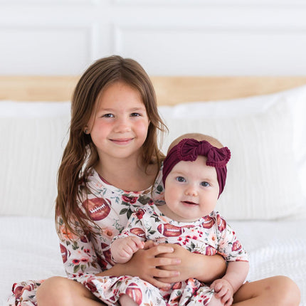 Footballs & Flowers 3/4 Sleeve Twirl Bodysuit